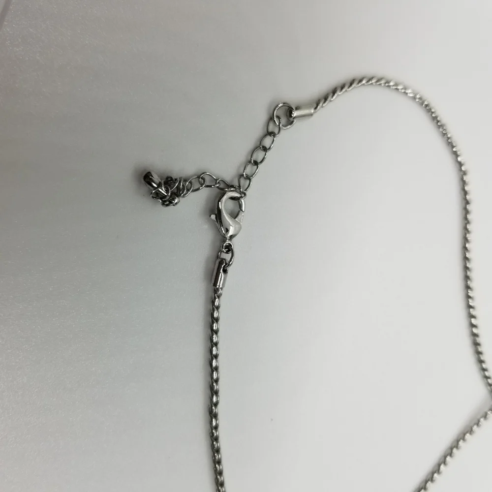 silver tone rope chain collar necklace with pave rhinestone crescent